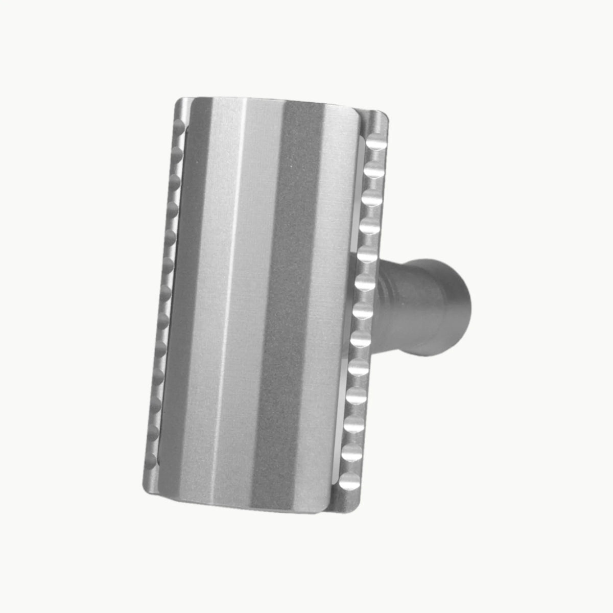 Silver safety razor on a white background